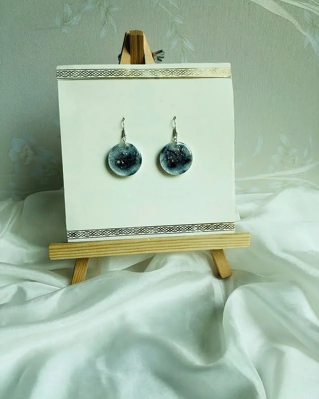 Our black and pearl resin earrings, featuring a